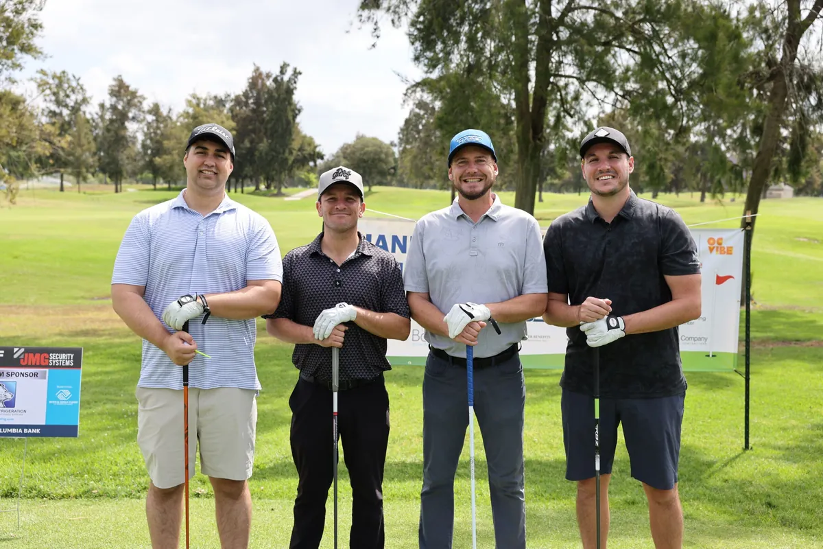 A foursome on the fairway at the 30th Annual Benefit Golf Tournament