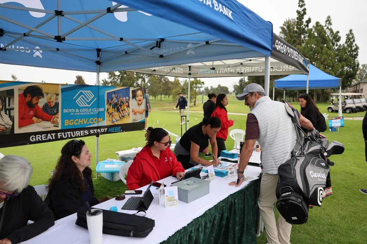 The registration table at the 30th Annual Benefit Golf Tournament